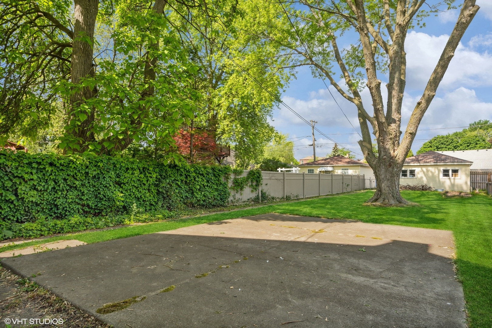 1816 North Nordica Avenue Chicago, IL 60707 - Photo 2 of 23 a view of a yard in front of a house with large trees