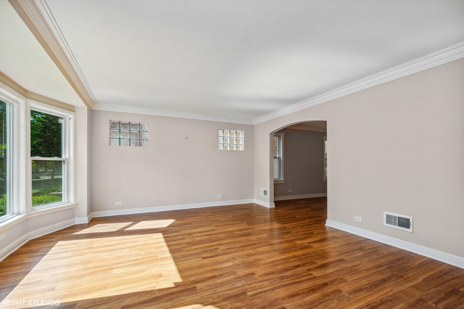 1816 North Nordica Avenue Chicago, IL 60707 - Photo 3 of 23 a view of an empty room with wooden floor and a window