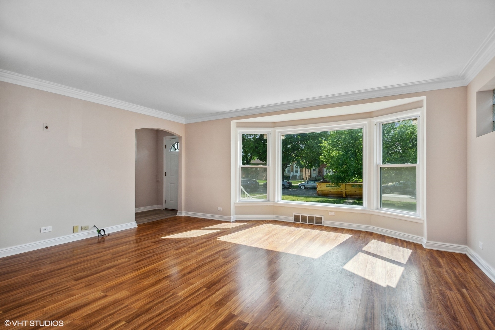 1816 North Nordica Avenue Chicago, IL 60707 - Photo 4 of 23 a view of an empty room with wooden floor and a window
