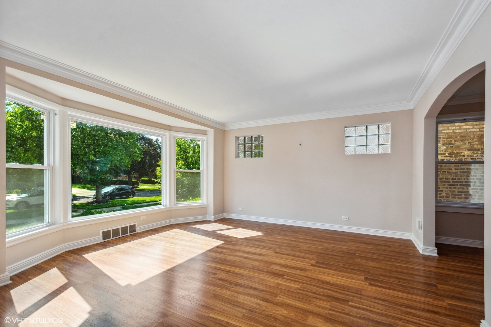 1816 North Nordica Avenue Chicago, IL 60707 - Photo 5 of 23 a view of an empty room with wooden floor and a window