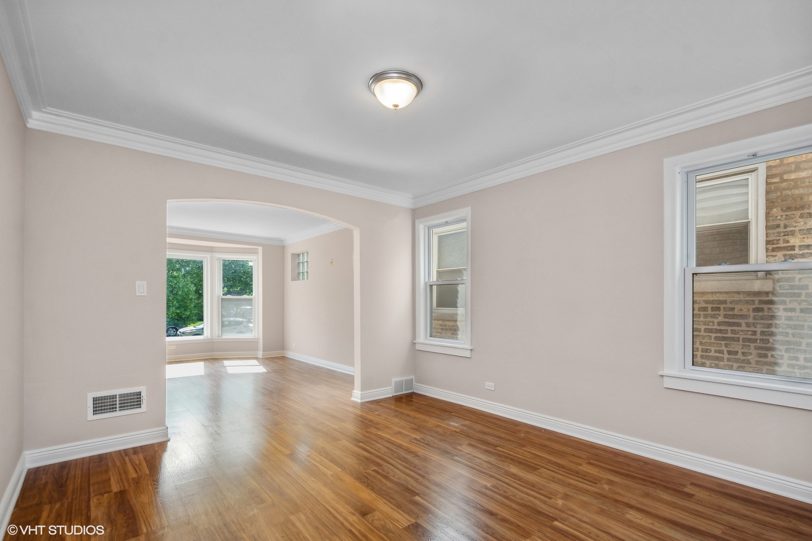 1816 North Nordica Avenue Chicago, IL 60707 - Photo 6 of 23 a view of an empty room with wooden floor and a window