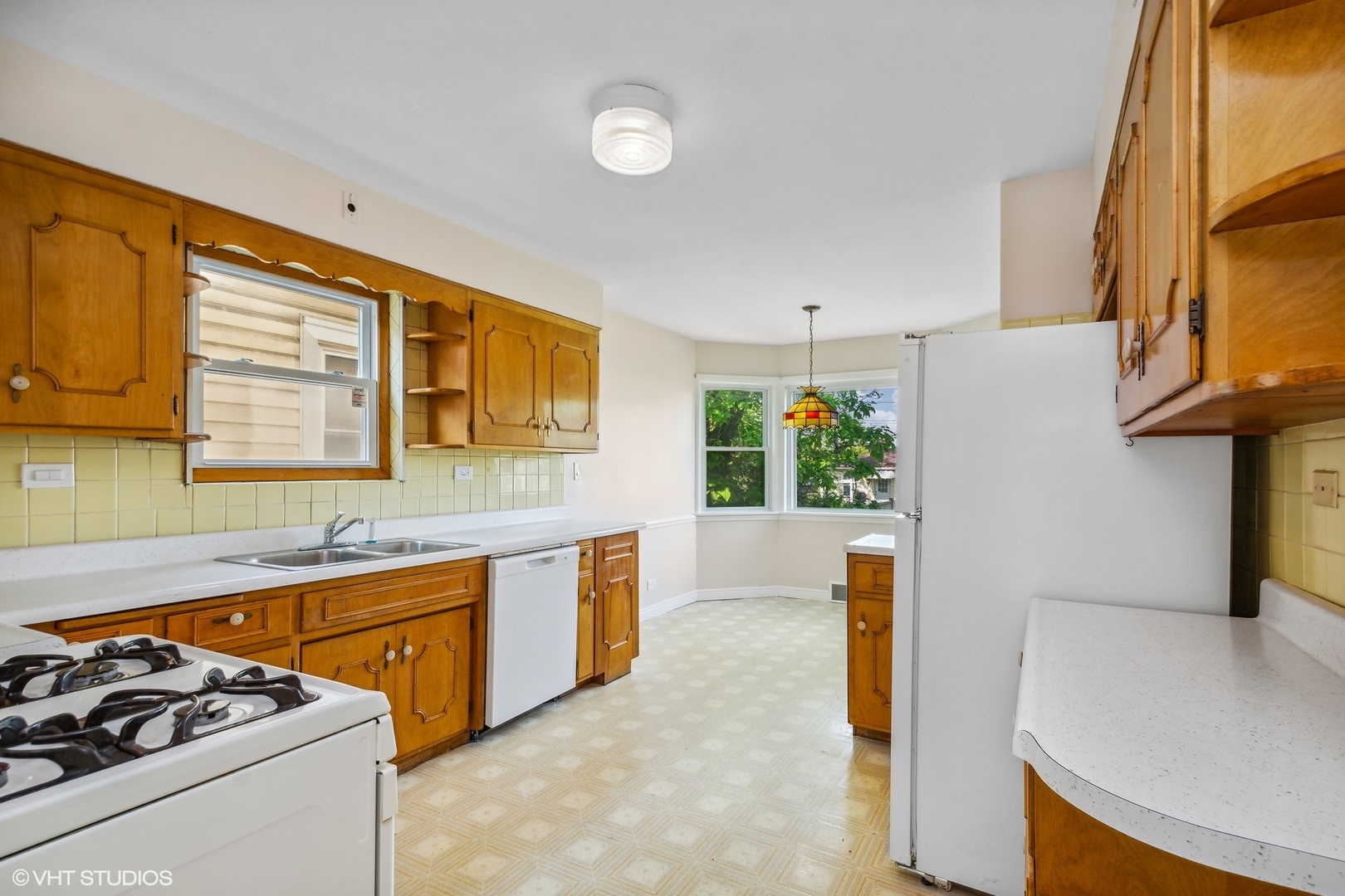 1816 North Nordica Avenue Chicago, IL 60707 - Photo 7 of 23 a view of a kitchen with furniture and a window