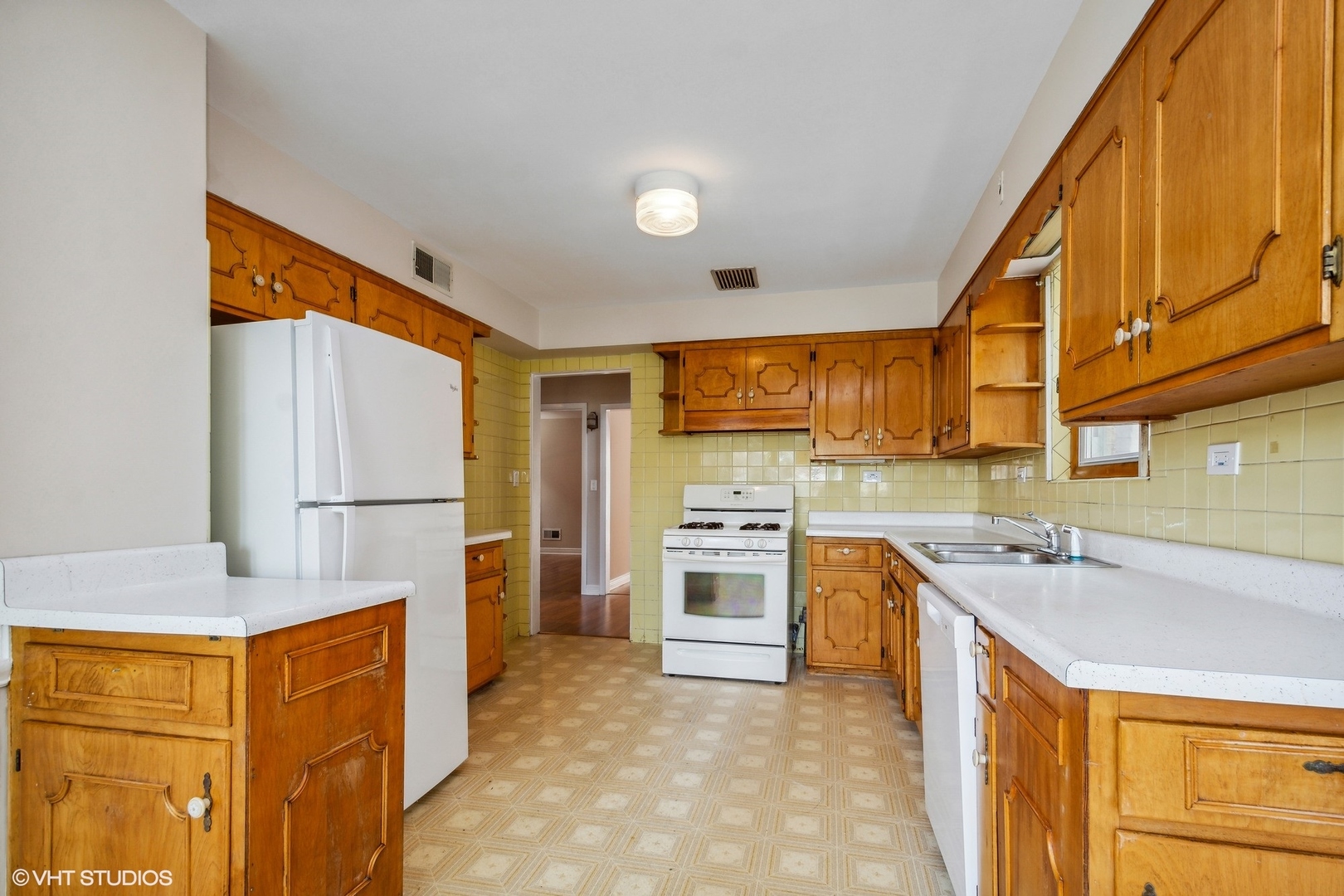 1816 North Nordica Avenue Chicago, IL 60707 - Photo 8 of 23 a kitchen with stainless steel appliances granite countertop a refrigerator a stove and a sink with cabinets