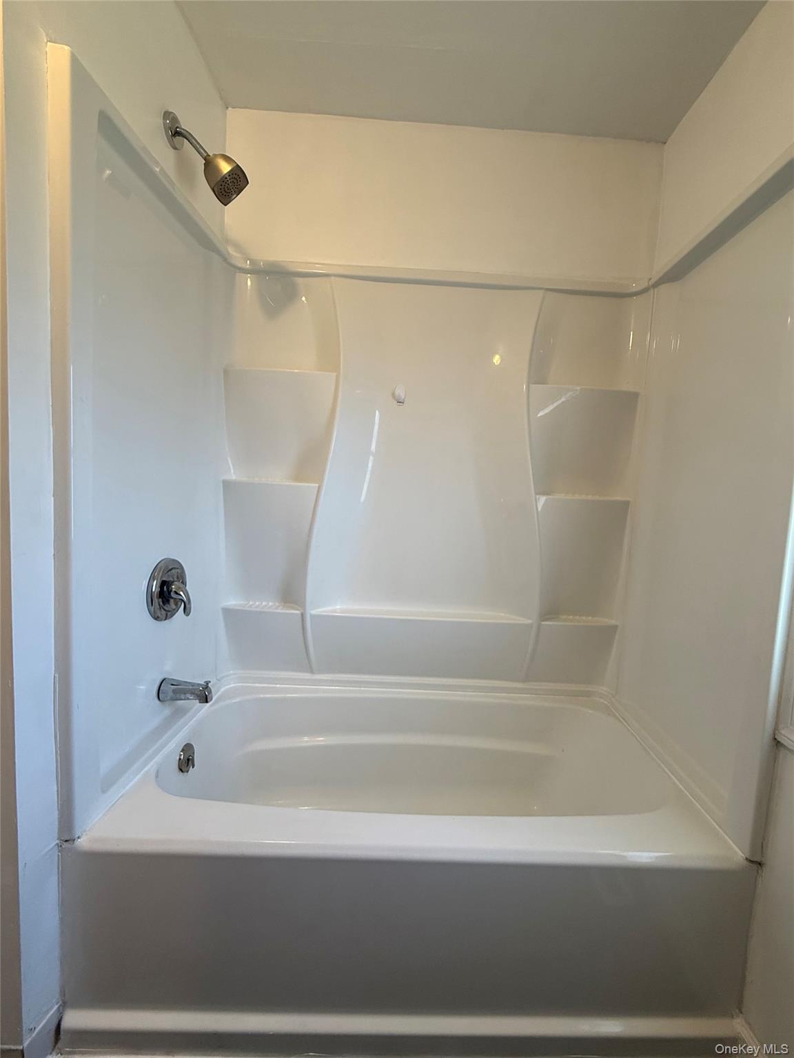 657 Eatontown Road Port Jervis, NY 12771 - Photo 9 of 14 a bathroom with a shower and a bath tub