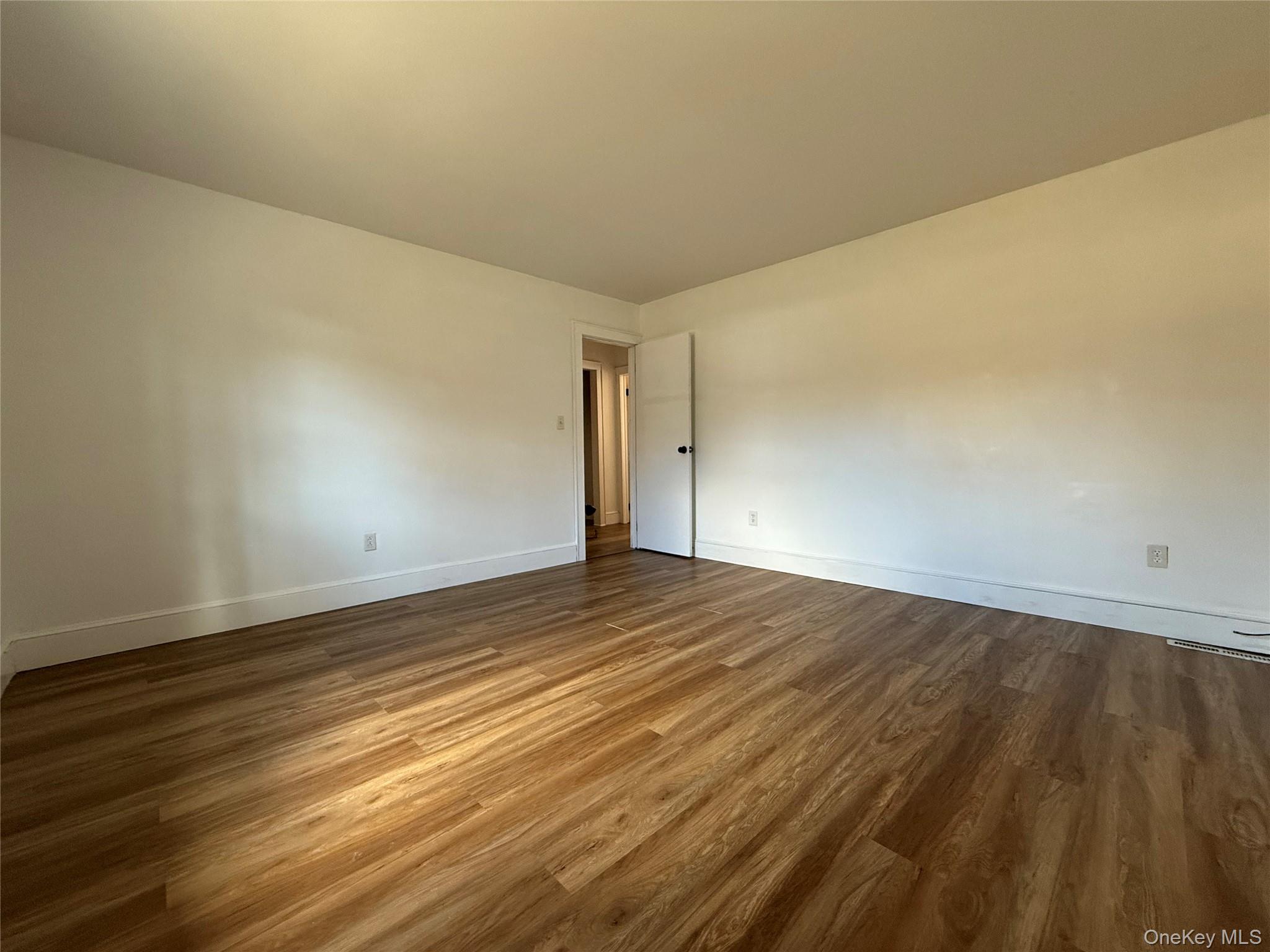 657 Eatontown Road Port Jervis, NY 12771 - Photo 10 of 14 a view of empty room with wooden floor