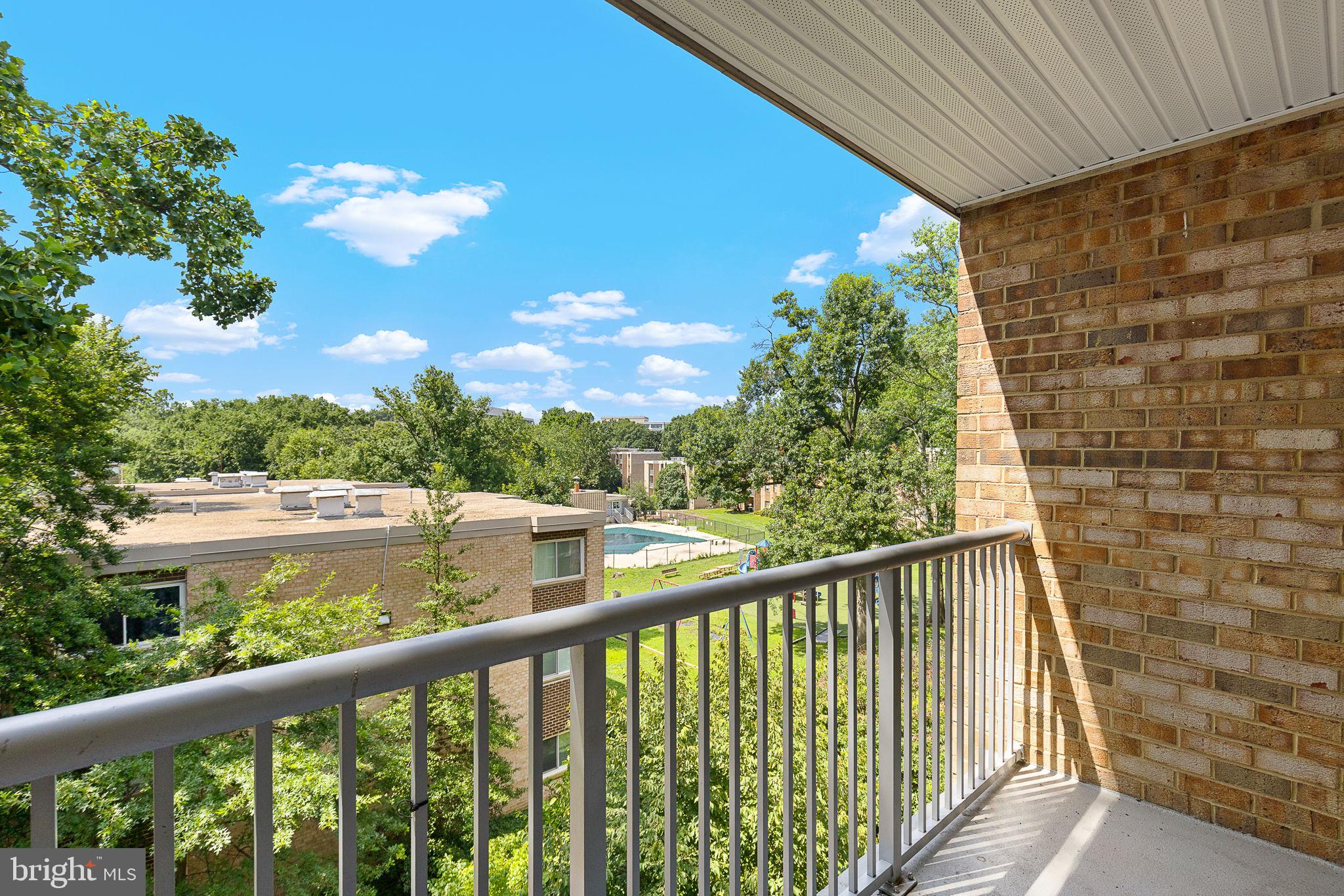 8001 Chanute Place, Unit 15 Falls Church, VA 22042 - Photo 21 of 32 View of common area and pool from balcony