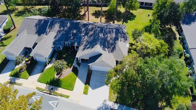 an aerial view of house with swimming pool