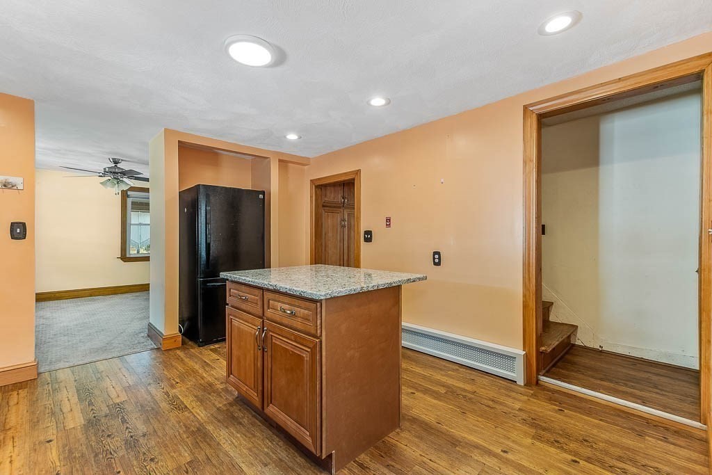 29 Berkeley Road Dedham, MA 02026 - Photo 14 of 35 a kitchen with stainless steel appliances a refrigerator and a stove