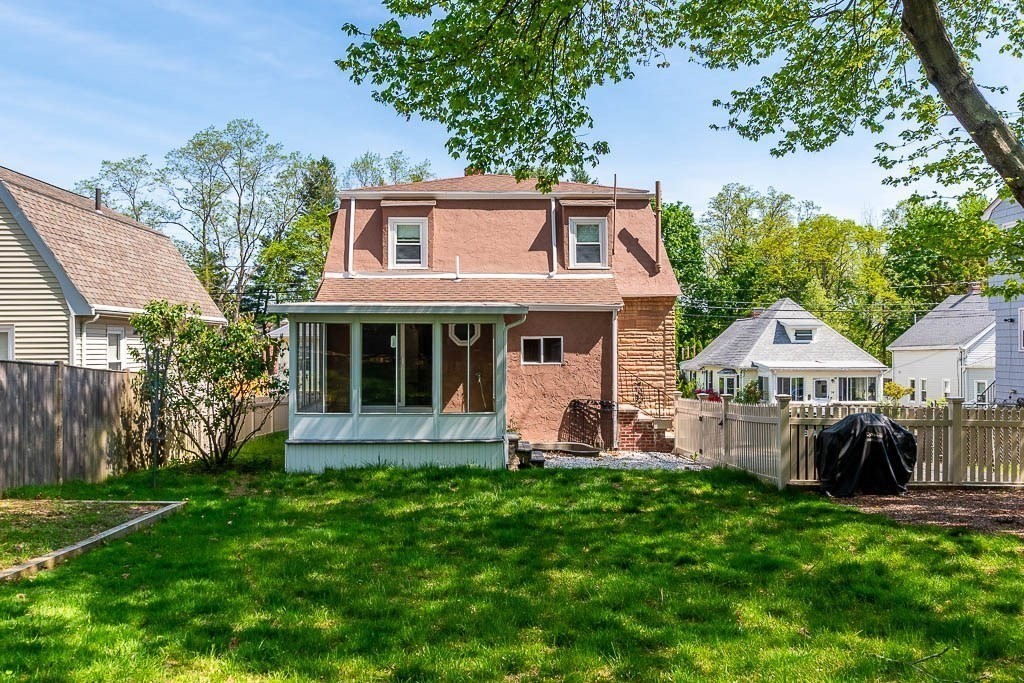 29 Berkeley Road Dedham, MA 02026 - Photo 2 of 35 a front view of a house with a yard and trees