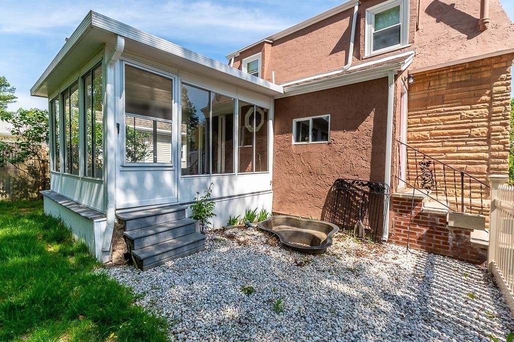 29 Berkeley Road Dedham, MA 02026 - Photo 28 of 35 a view of house with backyard outdoor seating and wooden floor