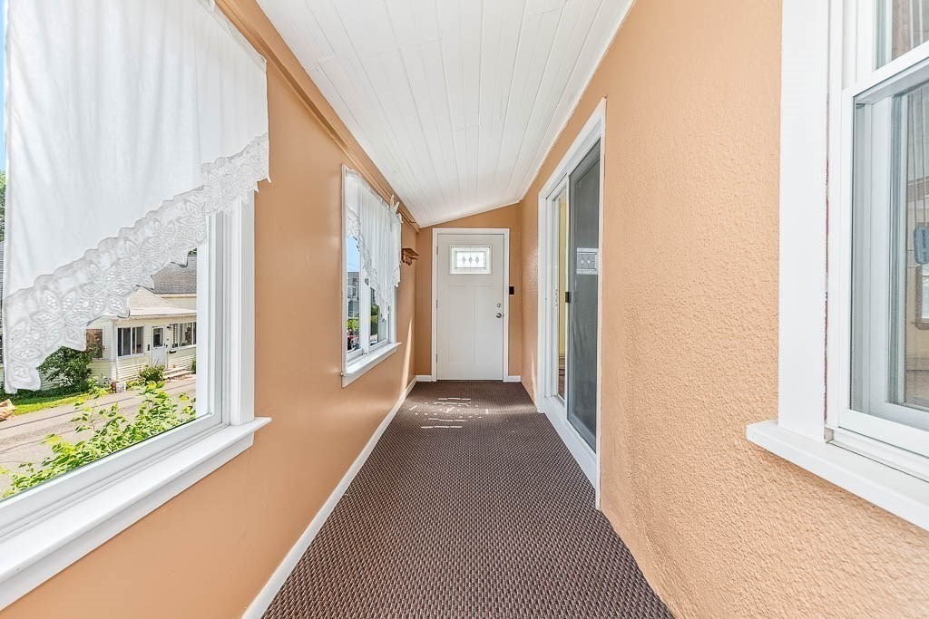 29 Berkeley Road Dedham, MA 02026 - Photo 5 of 35 a view of a hallway with windows