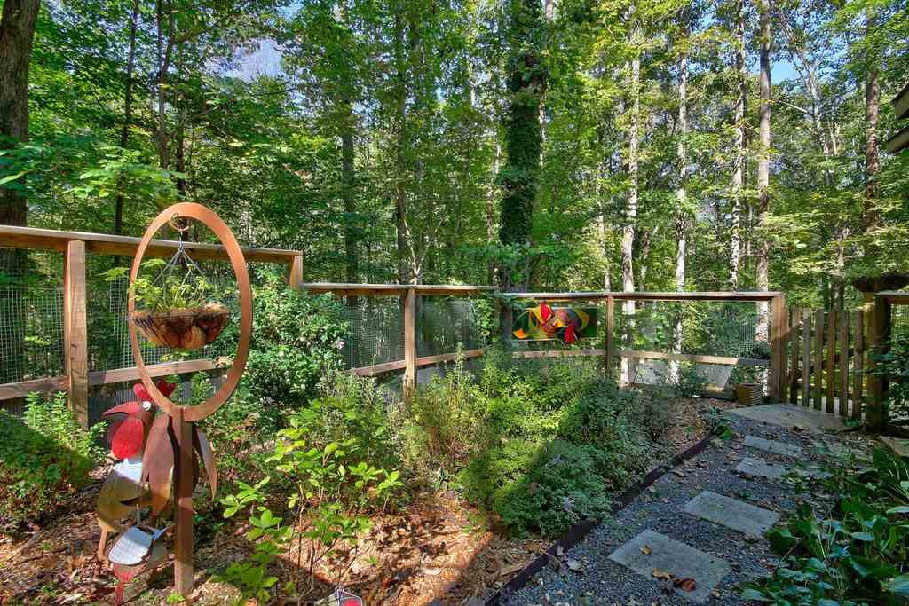 11312 Saddleview Court Raleigh, NC 27613 - Photo 23 of 25 Grow your garden in the already established fenced in garden retreat! NO deer or rabbits allowed here since already fenced for you. Garden