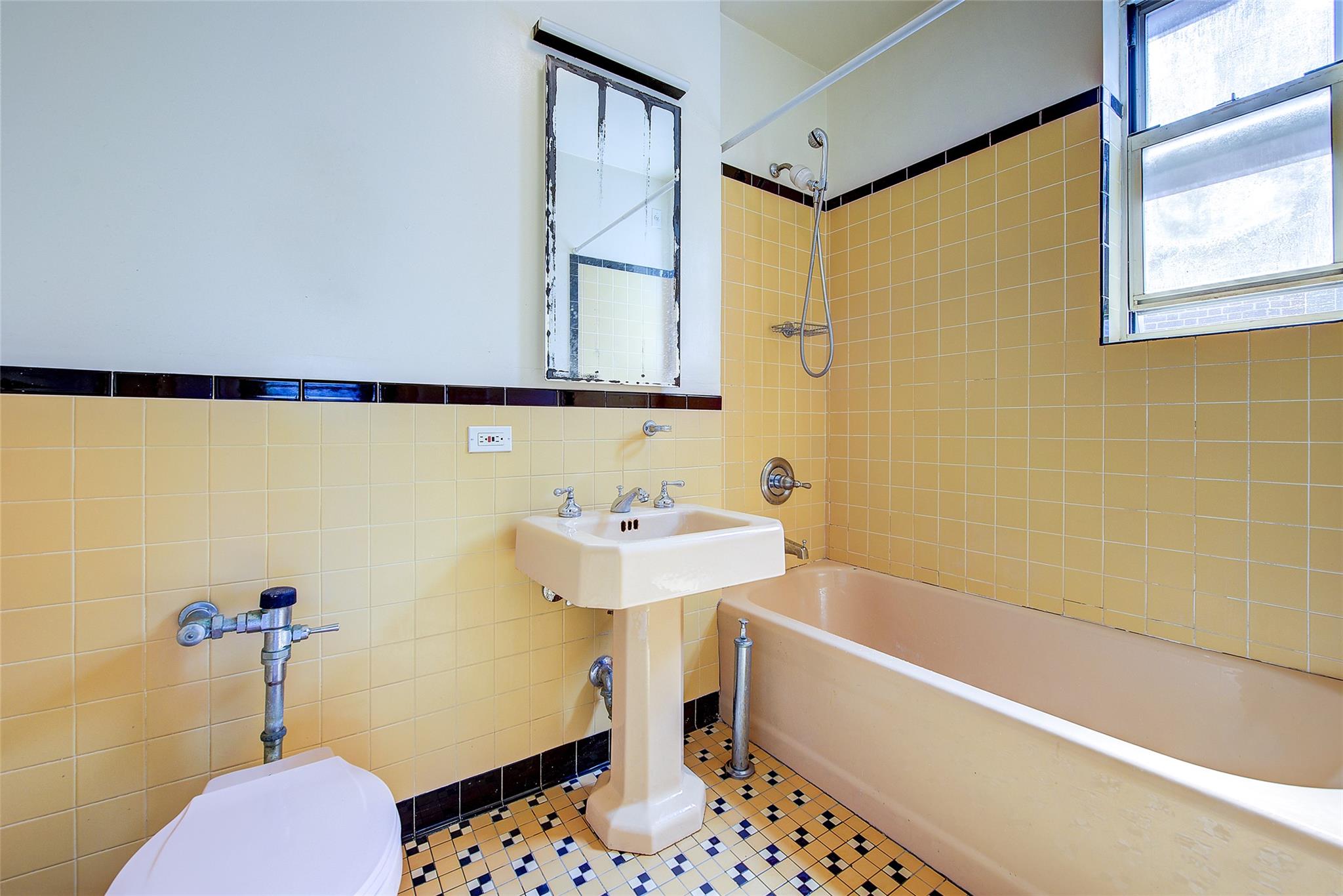 117-01 Park Lane South, Unit C5D Queens, NY 11418 - Photo 24 of 33 a bathroom with a sink and a bathtub