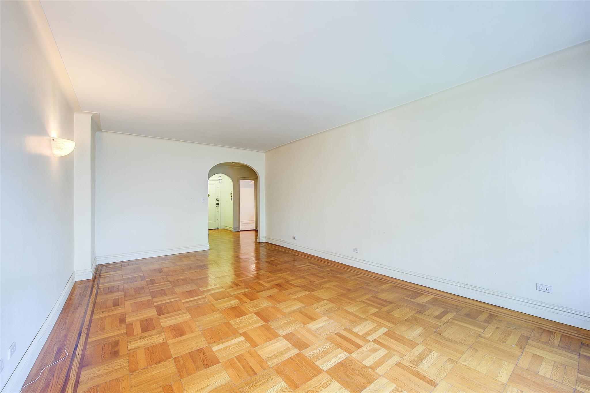 117-01 Park Lane South, Unit C5D Queens, NY 11418 - Photo 7 of 33 a view of a room with a wooden floor and window
