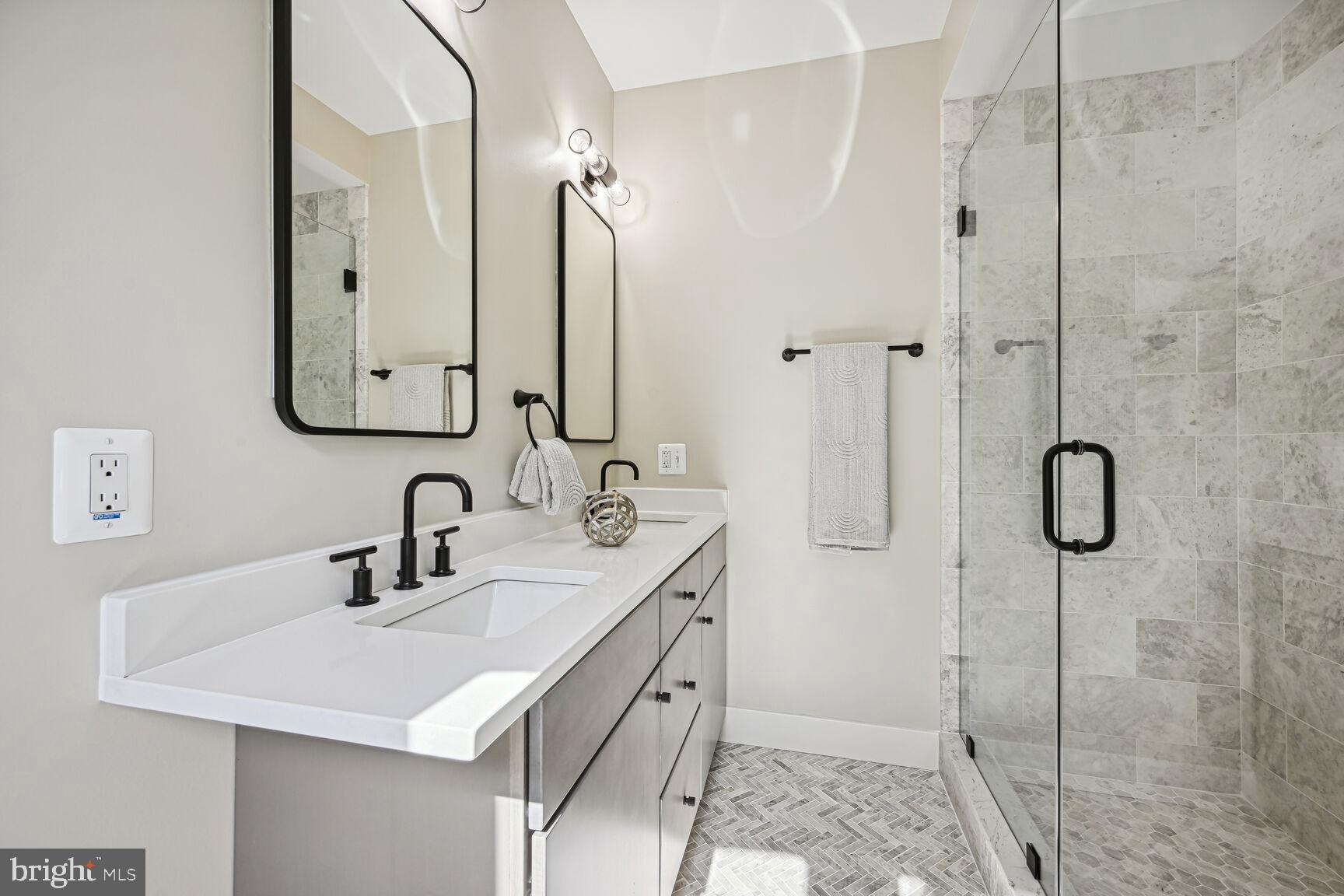 1820 19th Street Northwest, Unit 3 Washington, DC 20009 - Photo 20 of 27 a bathroom with a sink vanity granite shower and a mirror