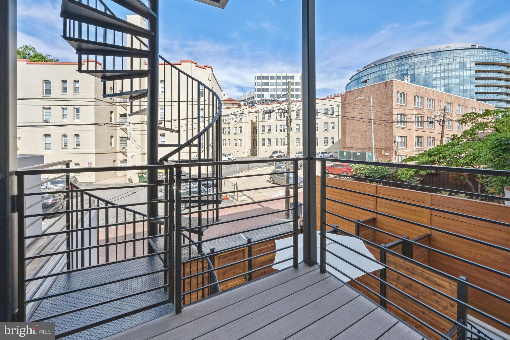 1820 19th Street Northwest, Unit 3 Washington, DC 20009 - Photo 27 of 27 a view of a balcony with wooden floor and windows