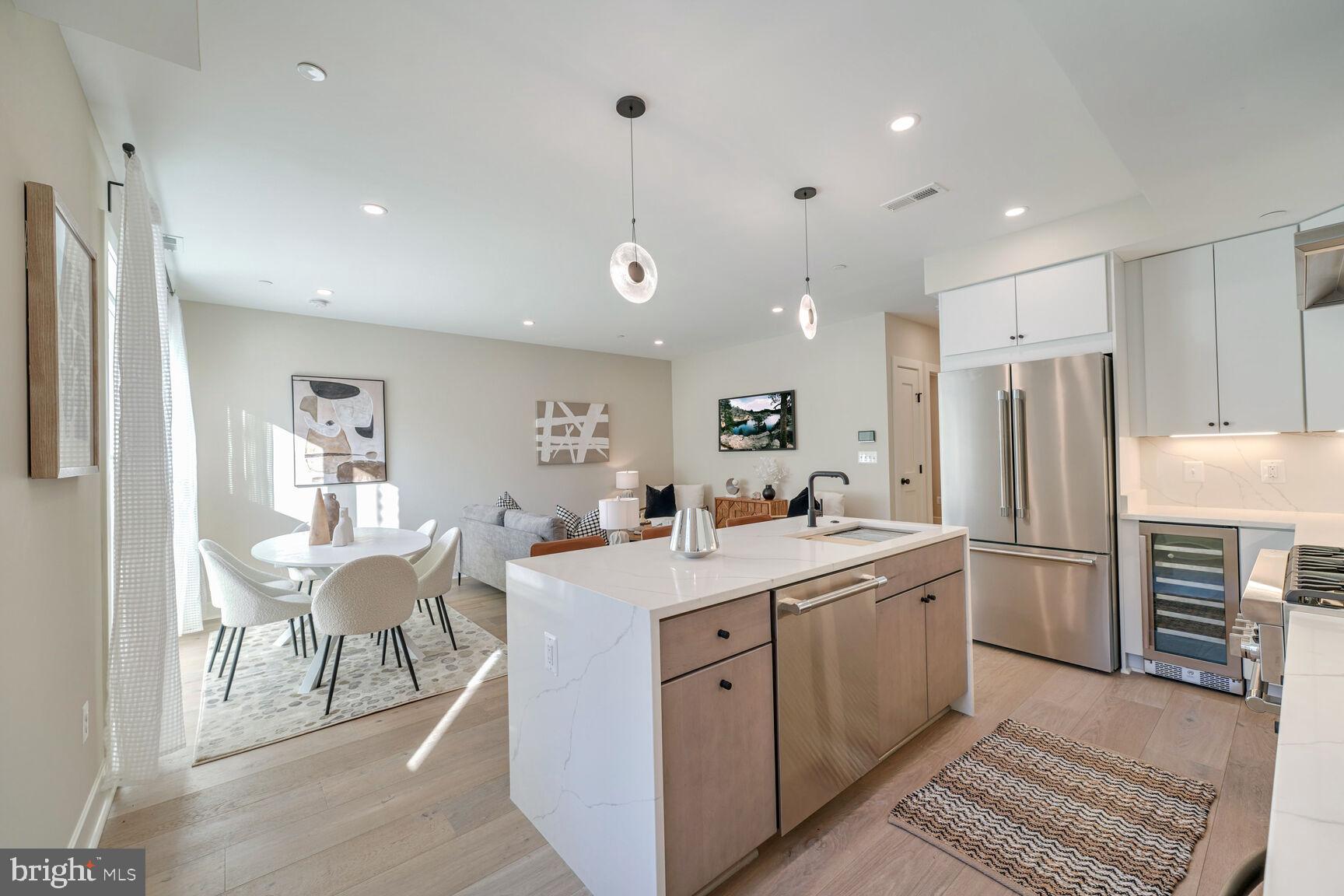 1820 19th Street Northwest, Unit 3 Washington, DC 20009 - Photo 9 of 27 a kitchen that has a lot of cabinets a sink and appliances in it