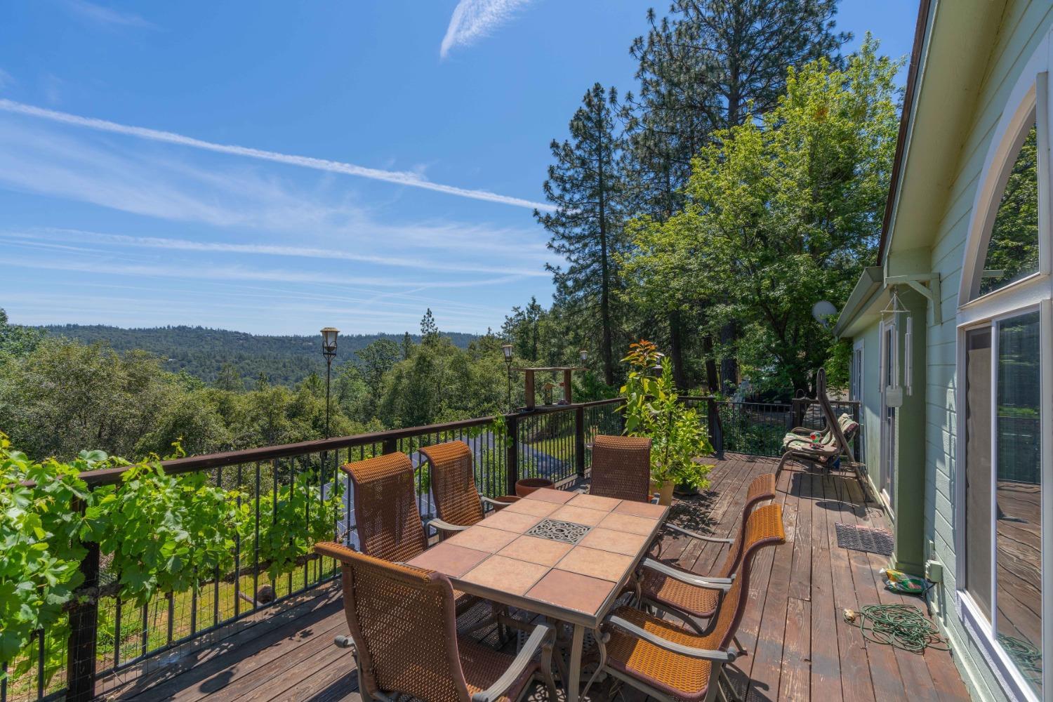 18301 Toyon Road Pine Grove, CA 95665 - Photo 13 of 15 a view of a balcony with wooden floor and outdoor seating