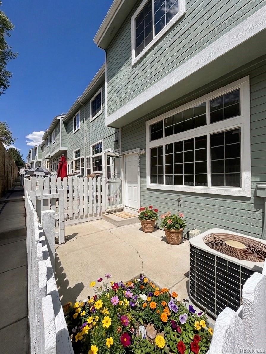 8199 Welby Road, Unit 4301 Denver, CO 80229 - Photo 16 of 19 a front view of a house with an outdoor space