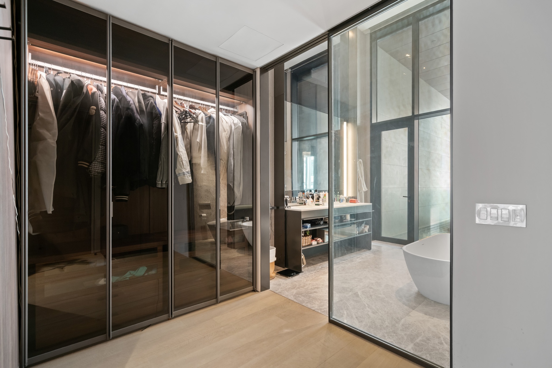 522 West 29th Street, Unit 5B Manhattan, NY 10001 - Photo 10 of 21 a bathroom with a glass shower door and a mirror