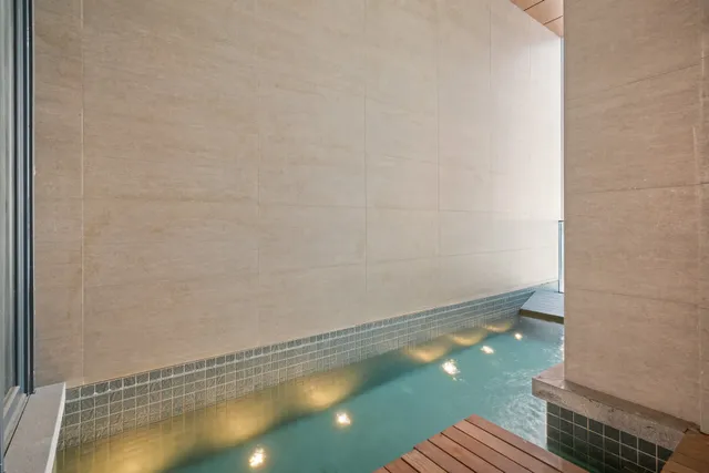 a balcony with outdoor seating and stairs