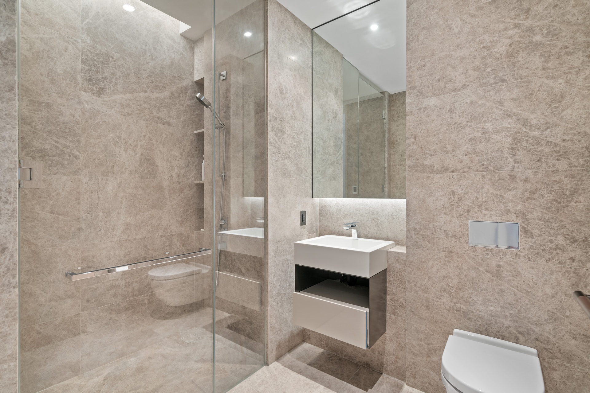 522 West 29th Street, Unit 5B Manhattan, NY 10001 - Photo 17 of 21 a bathroom with a toilet a sink and mirror