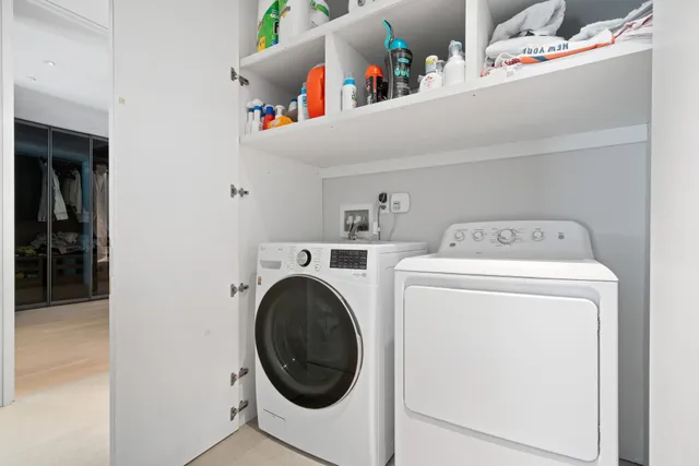 a bathroom with a toilet a sink and a mirror