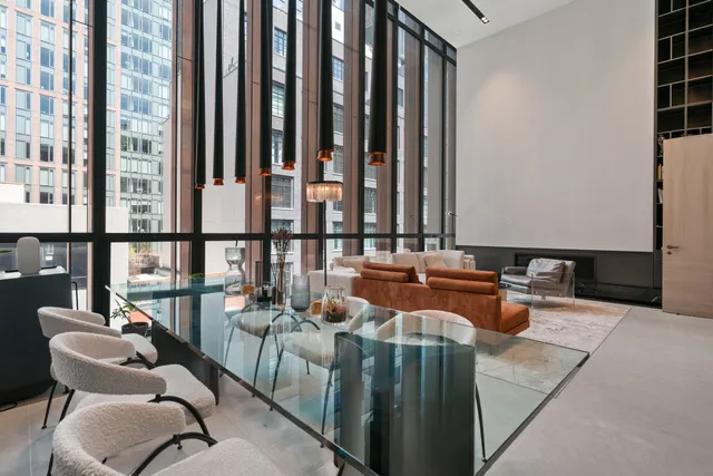 a balcony with furniture and a potted plant