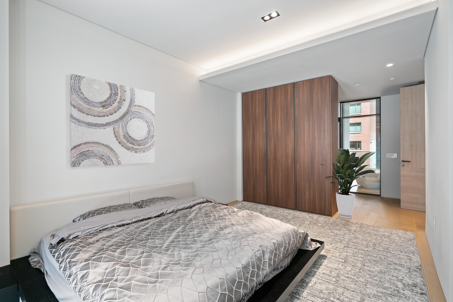 522 West 29th Street, Unit 5B Manhattan, NY 10001 - Photo 9 of 21 a bedroom with bed and wooden floor