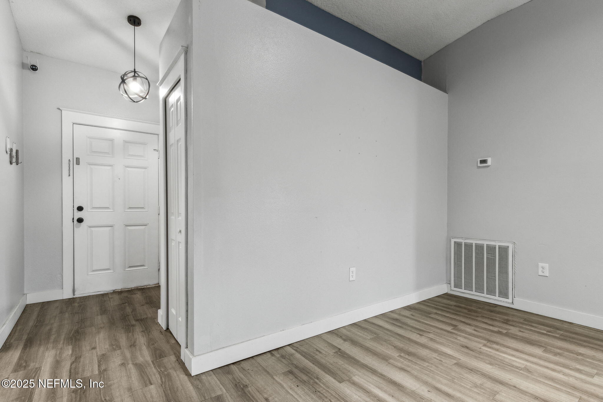 76564 Longleaf Loop Yulee, FL 32097 - Photo 11 of 54 wooden floor in an empty room