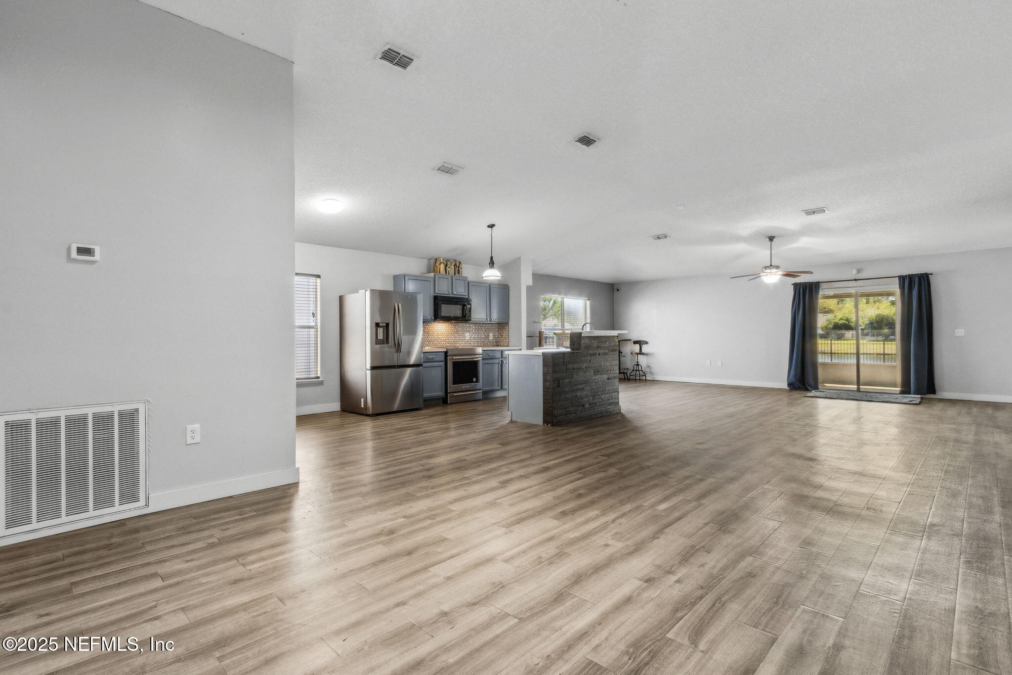 76564 Longleaf Loop Yulee, FL 32097 - Photo 14 of 54 a view of a kitchen with a sink and a stove top oven