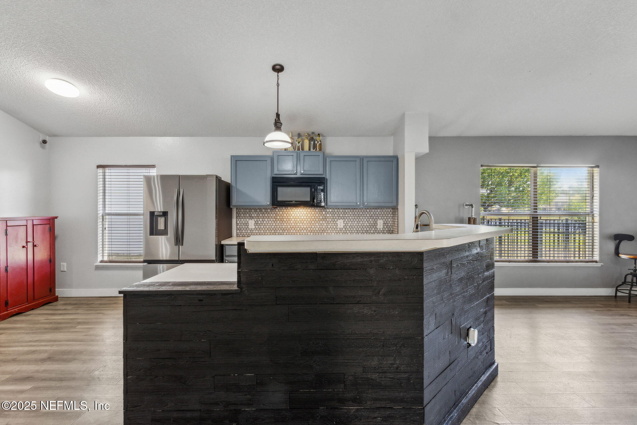 76564 Longleaf Loop Yulee, FL 32097 - Photo 17 of 54 a kitchen with stainless steel appliances granite countertop a sink and a stove