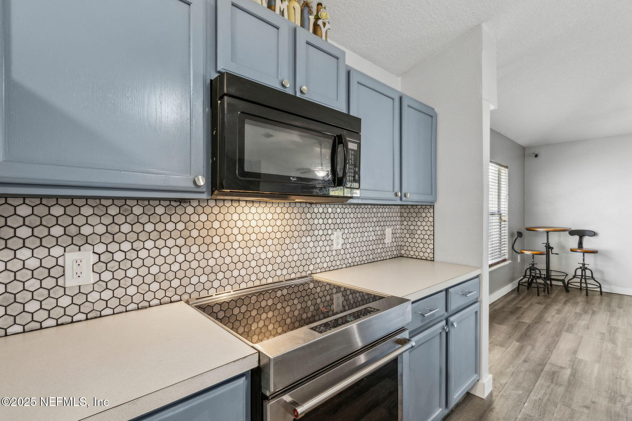 76564 Longleaf Loop Yulee, FL 32097 - Photo 20 of 54 a kitchen with a sink stove and microwave