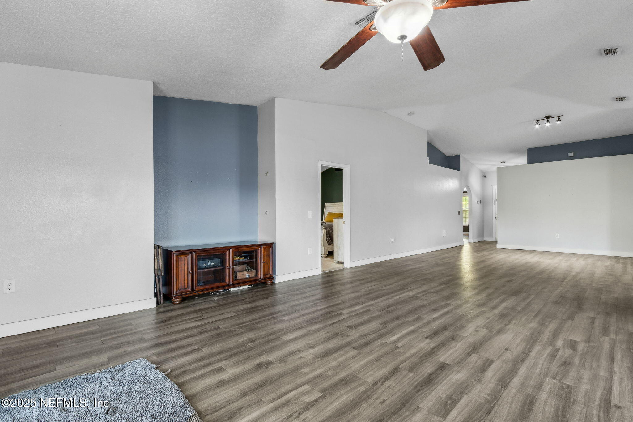 76564 Longleaf Loop Yulee, FL 32097 - Photo 24 of 54 a view of empty room with wooden floor and window
