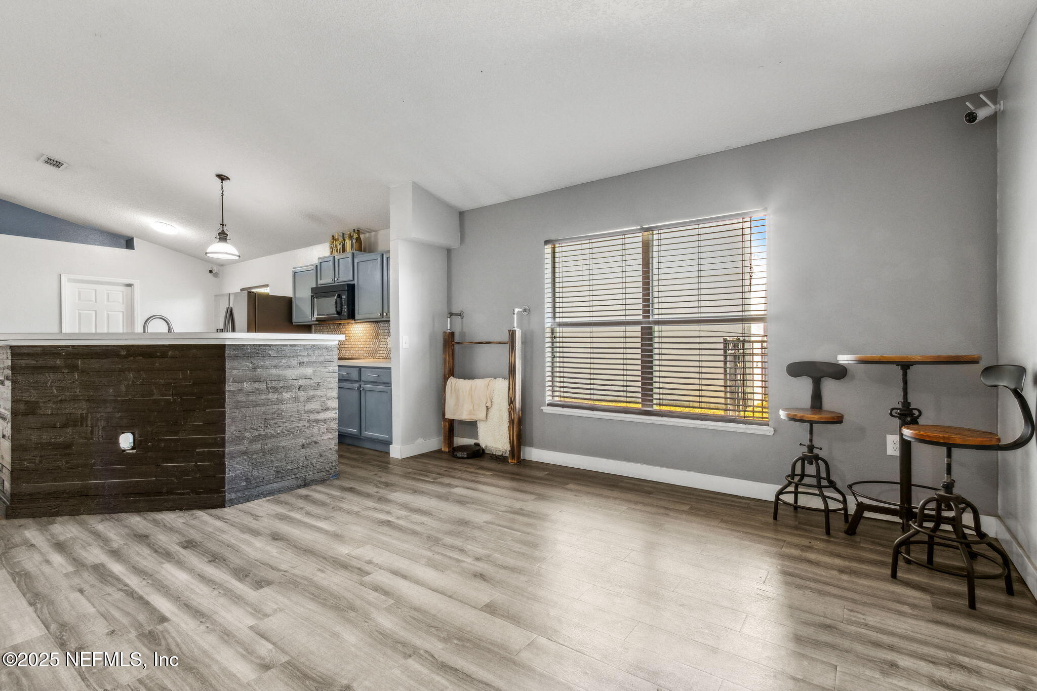 76564 Longleaf Loop Yulee, FL 32097 - Photo 26 of 54 a large bedroom with a bed and a window