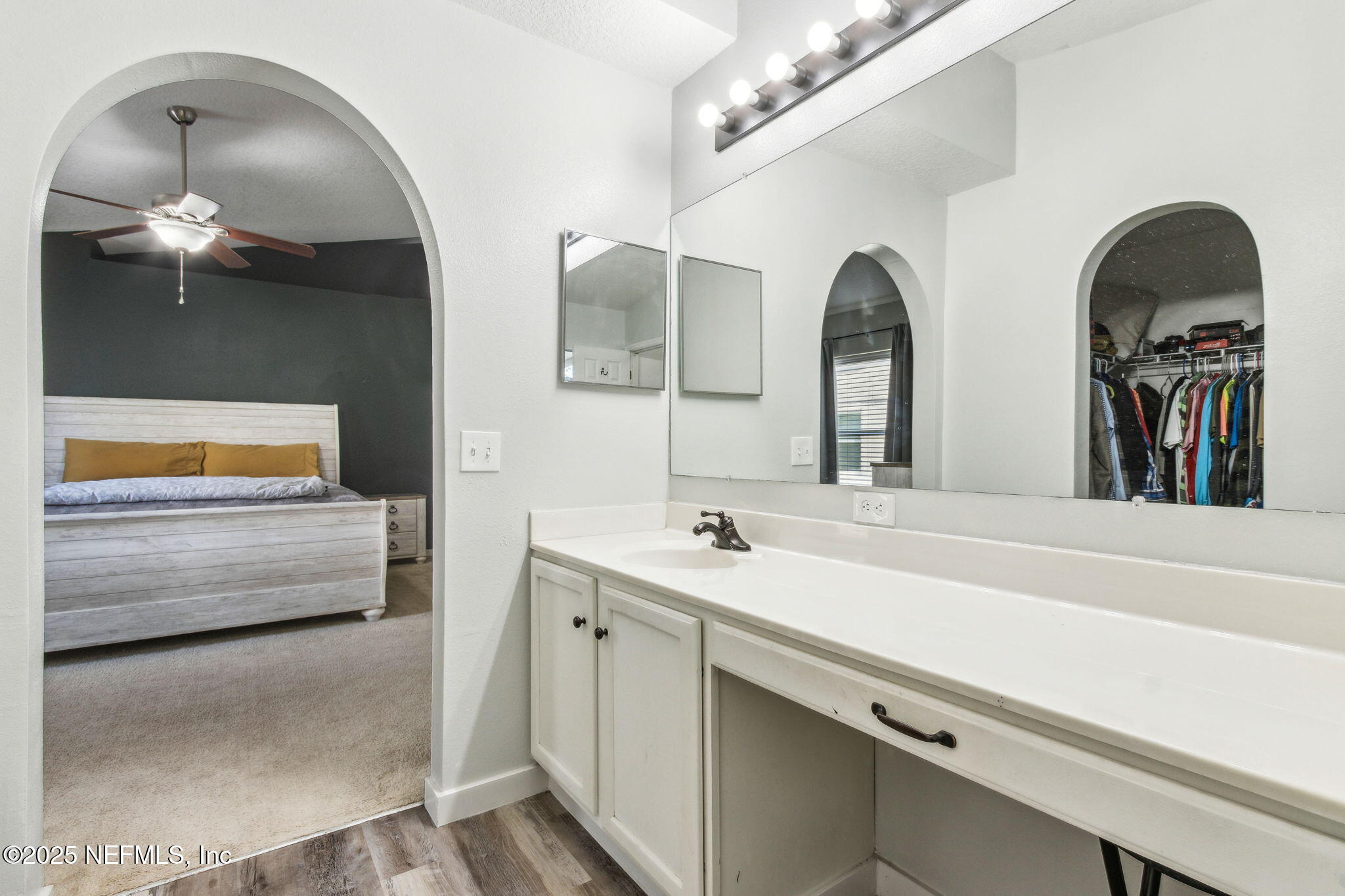76564 Longleaf Loop Yulee, FL 32097 - Photo 35 of 54 a bathroom with a double vanity sink and a mirror