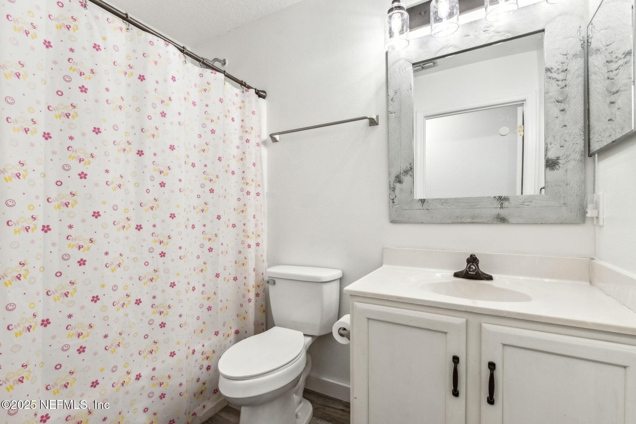 76564 Longleaf Loop Yulee, FL 32097 - Photo 40 of 54 a bathroom with a sink toilet and mirror