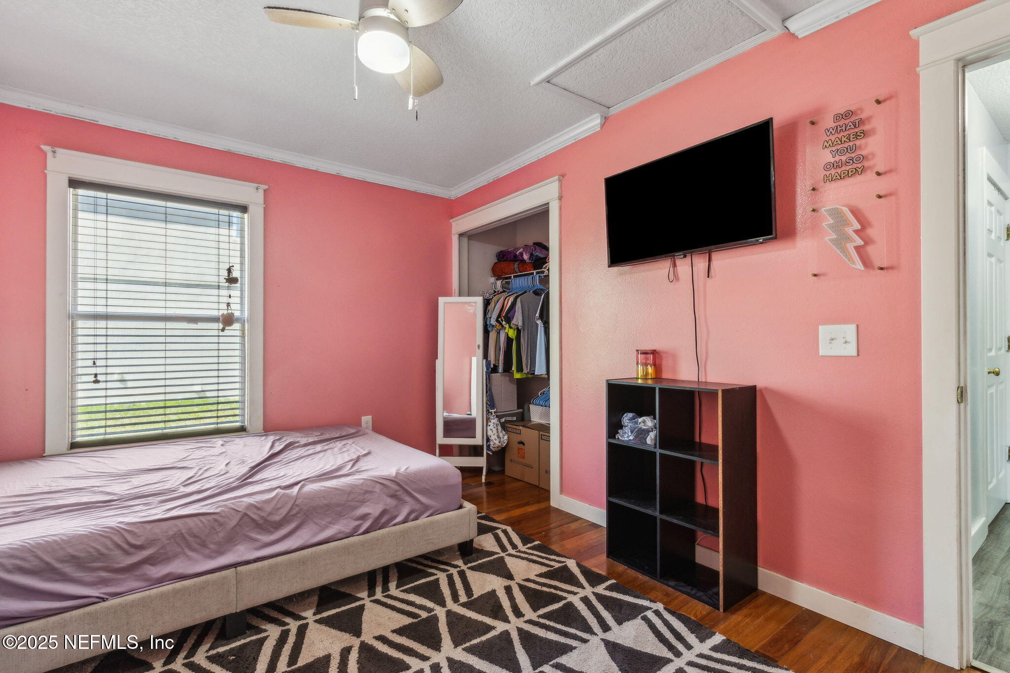 76564 Longleaf Loop Yulee, FL 32097 - Photo 42 of 54 a bedroom with a bed and a flat screen tv