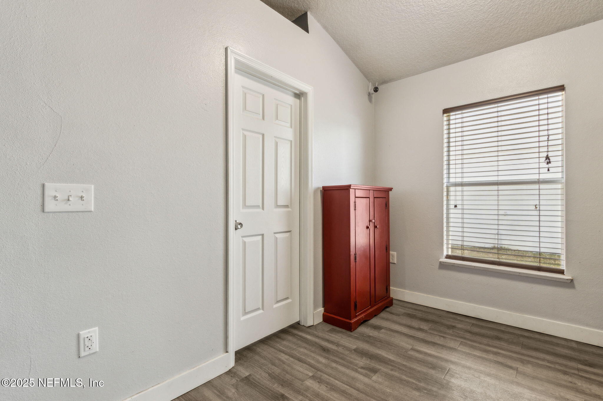 76564 Longleaf Loop Yulee, FL 32097 - Photo 43 of 54 a view of wooden floor and windows in a room