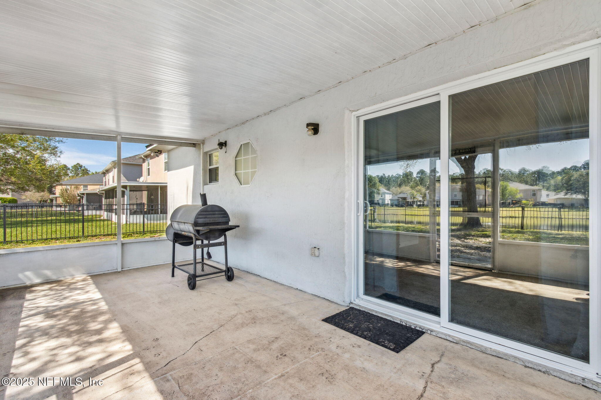 76564 Longleaf Loop Yulee, FL 32097 - Photo 44 of 54 a view of a porch with furniture and garden
