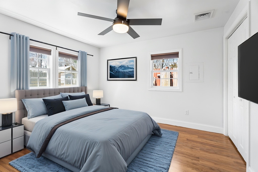 32 Shaw Road Brockton, MA 02301 - Photo 11 of 27 a bedroom with a large bed and a tv