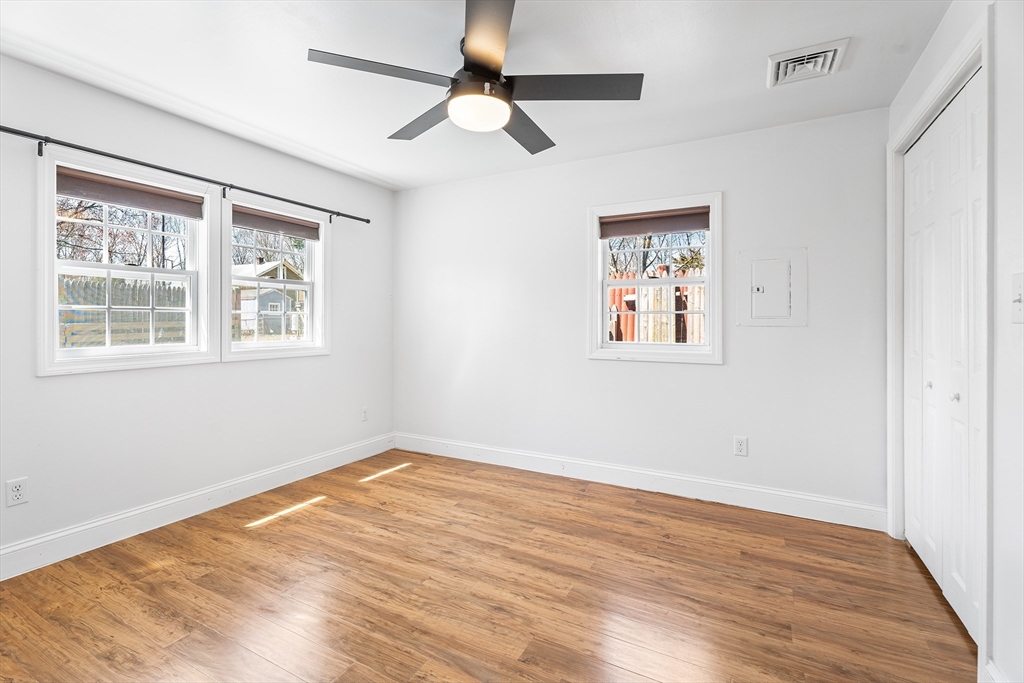 32 Shaw Road Brockton, MA 02301 - Photo 12 of 27 a view of empty room with wooden floor and fan