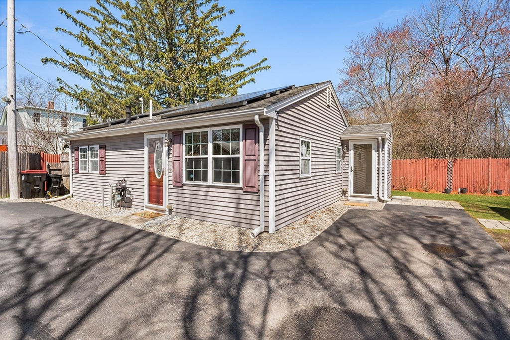 32 Shaw Road Brockton, MA 02301 - Photo 2 of 27 a front view of a house with a garage