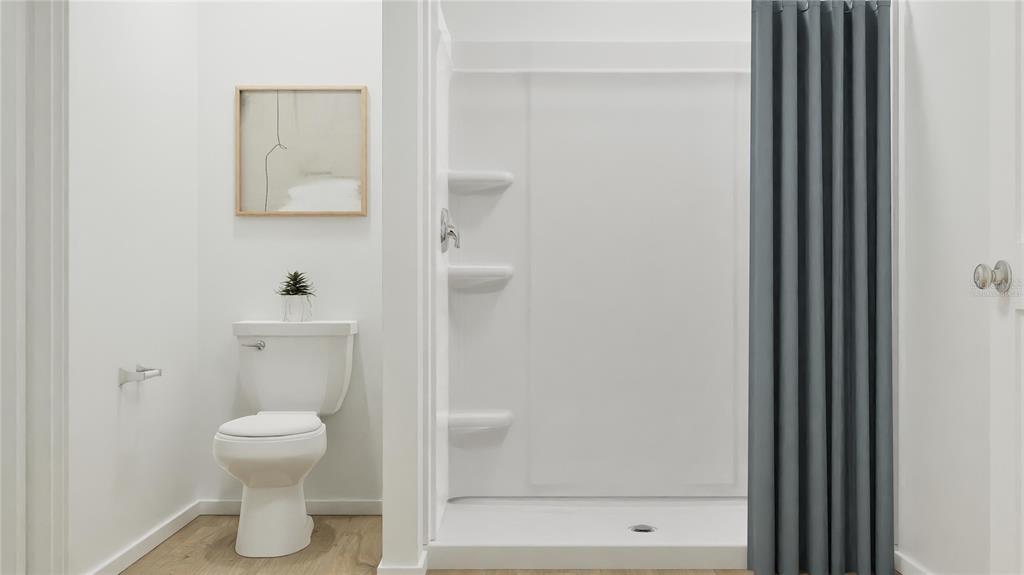 5620 Morant Bay Path Kissimmee, FL 34758 - Photo 21 of 34 a bathroom with a toilet and a shower