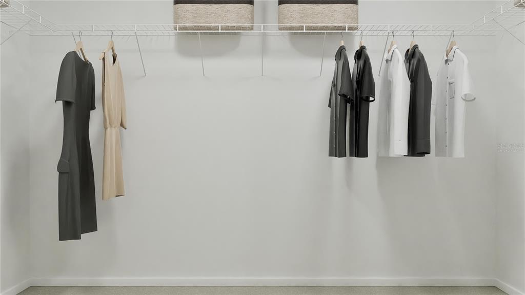 5620 Morant Bay Path Kissimmee, FL 34758 - Photo 22 of 34 a view of walk in closet with clothes