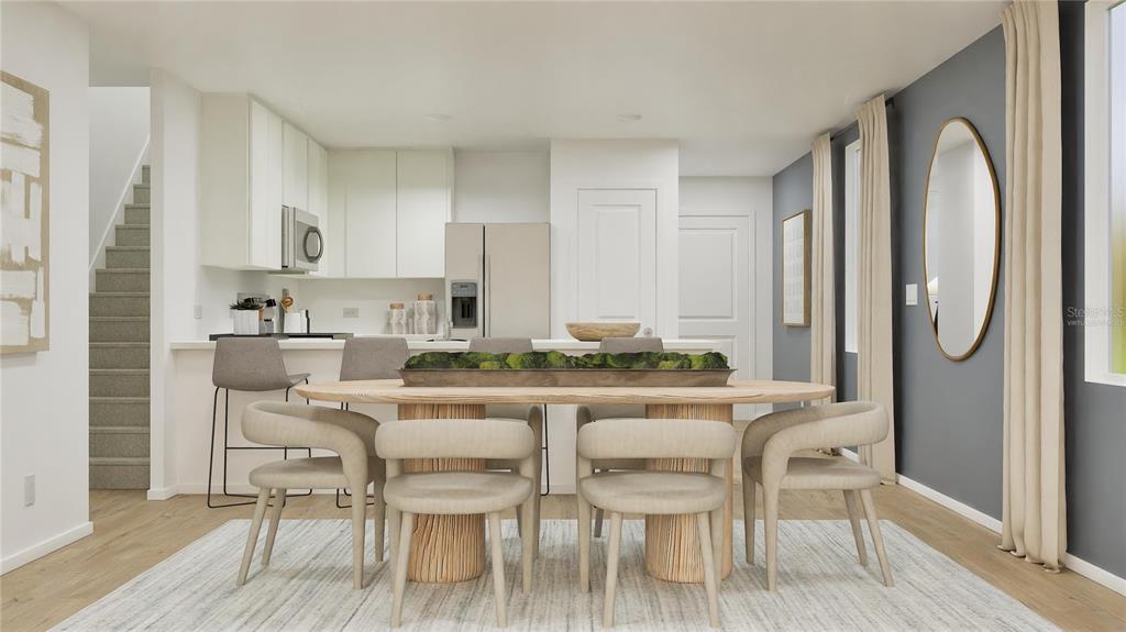 5620 Morant Bay Path Kissimmee, FL 34758 - Photo 4 of 34 a view of a dining room with furniture and wooden floor