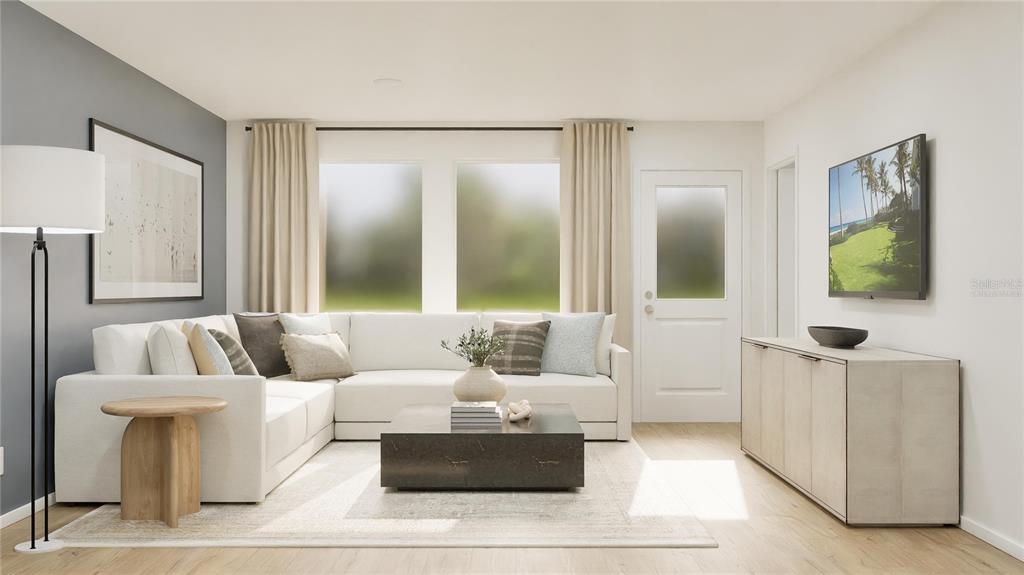 5620 Morant Bay Path Kissimmee, FL 34758 - Photo 7 of 34 a living room with furniture and a large mirror