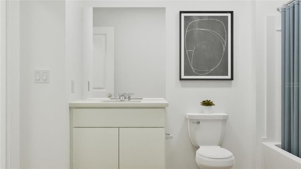 5620 Morant Bay Path Kissimmee, FL 34758 - Photo 8 of 34 a bathroom with a toilet a sink and mirror