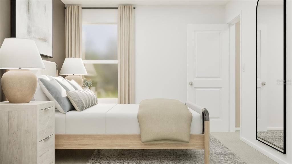 5620 Morant Bay Path Kissimmee, FL 34758 - Photo 10 of 34 a bedroom with a bed and a mirror