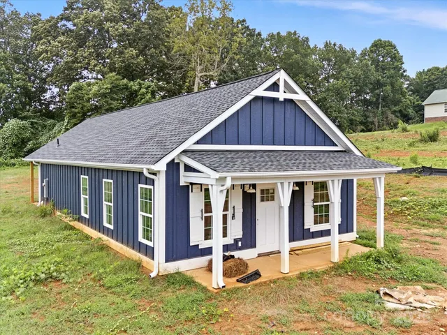 a front view of a house with yard